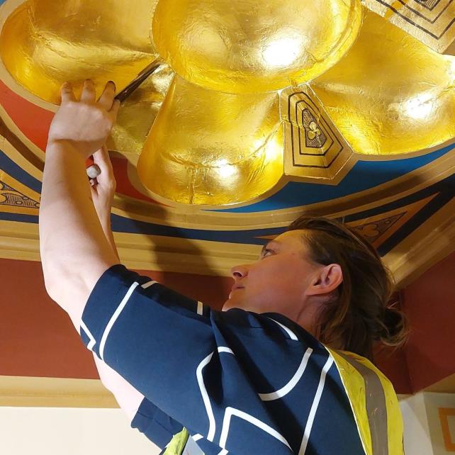 Gilding and painting work on the restoration of William Burges's neo-Gothic decorative scheme in the Lord Mayor's Drawing Room in the historic MaisonDieu in Dover. England